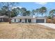 Charming home with a gray front door, inviting porch, and a well-maintained lawn at 402 Woodward Blvd, Summerville, SC 29483