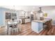 Open concept kitchen with stainless appliances, granite counters, and adjacent dining area at 402 Woodward Blvd, Summerville, SC 29483