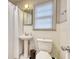 Clean bathroom featuring a pedestal sink, toilet, and shower with a white curtain at 406 Annette Dr, Goose Creek, SC 29445