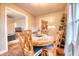 Cozy dining room with a round table, seating for four, and hardwood flooring at 406 Annette Dr, Goose Creek, SC 29445
