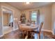 Cozy dining area with hardwood floors, round table, and neutral decor at 406 Annette Dr, Goose Creek, SC 29445