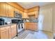 Bright kitchen with wood cabinets, stainless appliances and decorative backsplash tiles at 406 Annette Dr, Goose Creek, SC 29445