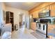 Spacious kitchen featuring stainless steel appliances, wooden cabinetry, and a tiled floor at 406 Annette Dr, Goose Creek, SC 29445