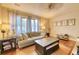 Bright living room featuring hardwood floors, large windows, and a comfortable sofa at 406 Annette Dr, Goose Creek, SC 29445