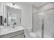 Modern bathroom featuring a glass-enclosed shower with white marble style tiles and a white vanity at 4414 Avery Ave, North Charleston, SC 29405
