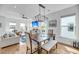 Inviting dining room with wooden table, bench seating, and modern light fixture at 4414 Avery Ave, North Charleston, SC 29405