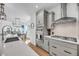 Bright kitchen showcases white countertops, gray cabinetry, and stainless steel appliances at 4414 Avery Ave, North Charleston, SC 29405