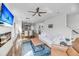 Sun-filled living room with hardwood floors, white sofa, and open floor plan at 4414 Avery Ave, North Charleston, SC 29405