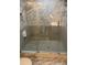 Modern bathroom features a glass-enclosed shower with decorative tile and updated fixtures at 4940 Lambs Road Rd, North Charleston, SC 29418