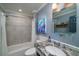 Well-lit bathroom featuring a tub-shower combo, single sink with granite countertop, and modern fixtures at 4940 Lambs Road Rd, North Charleston, SC 29418