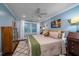 Inviting bedroom with a plush bed, neutral colors, elegant decor, a ceiling fan, and a bright window at 4940 Lambs Road Rd, North Charleston, SC 29418