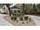 Charming home featuring a well manicured front yard with a circular driveway and appealing curb appeal at 4940 Lambs Road Rd, North Charleston, SC 29418