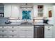 Charming kitchen with granite countertops, stainless steel appliances, and white cabinetry at 4940 Lambs Road Rd, North Charleston, SC 29418