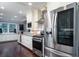 Modern kitchen with stainless steel appliances, granite countertops, and ample cabinet space at 4940 Lambs Road Rd, North Charleston, SC 29418