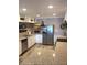 Updated kitchen with granite countertops, stainless steel appliances, and recessed lighting at 4940 Lambs Road Rd, North Charleston, SC 29418