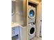 Convenient laundry area with stacked washer and dryer and vanity at 4940 Lambs Road Rd, North Charleston, SC 29418