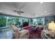 Spacious living room with large windows, comfortable seating, and views of the outdoors at 4940 Lambs Road Rd, North Charleston, SC 29418
