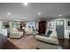 Cozy living room with hardwood floors, neutral paint, and lots of natural light at 4940 Lambs Road Rd, North Charleston, SC 29418