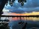 Picturesque sunset view overlooking the tranquil river and private dock at 4940 Lambs Road Rd, North Charleston, SC 29418
