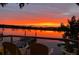Breathtaking water view featuring a vibrant orange sunset over the river from the outdoor seating area at 4940 Lambs Road Rd, North Charleston, SC 29418