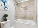 Modern bathroom with glass enclosed tub, stylish tile, and elegant fixtures at 5413 Barnsley Dr, North Charleston, SC 29420