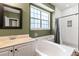 Bathroom with tub and shower, vanity with light marble countertop at 5413 Barnsley Dr, North Charleston, SC 29420