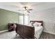 Comfortable bedroom featuring dark wooden furniture, soft carpet, and bright light from the window at 5413 Barnsley Dr, North Charleston, SC 29420