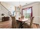 Elegant dining area featuring wood floors, decorative chandelier, and ample seating at 5413 Barnsley Dr, North Charleston, SC 29420