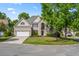 Lovely brick home on a corner lot with well-maintained landscaping and a two-car garage at 5413 Barnsley Dr, North Charleston, SC 29420