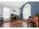 Bright home office with large windows, stylish wallpaper, and dual desks for comfortable working at 5413 Barnsley Dr, North Charleston, SC 29420