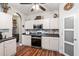 Modern kitchen with white cabinets, stylish backsplash, and stainless steel appliances at 5413 Barnsley Dr, North Charleston, SC 29420