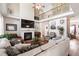 Spacious living room features soaring ceilings, fireplace, hardwood floors, and ample natural light at 5413 Barnsley Dr, North Charleston, SC 29420
