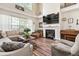 Comfortable living space featuring a fireplace, hardwood floors, and a large sectional at 5413 Barnsley Dr, North Charleston, SC 29420