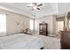 Large main bedroom with tray ceiling, soft carpet and elegant furnishings at 5413 Barnsley Dr, North Charleston, SC 29420