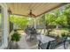 Covered patio with outdoor furniture, ceiling fan, and views of the landscaped backyard at 5413 Barnsley Dr, North Charleston, SC 29420