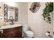 Charming powder room with unique mirror, decorative wall art, and a stylish vanity at 5413 Barnsley Dr, North Charleston, SC 29420