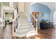 Welcoming foyer with a carpeted staircase and wood flooring at 5413 Barnsley Dr, North Charleston, SC 29420