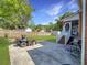 Landscaped backyard featuring a zero turn mower and an enclosed back porch at 5505 Indigo Makers Trce, Charleston, SC 29418