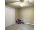 A bedroom with a ceiling fan and carpeted floor has a large closet for storage at 5505 Indigo Makers Trce, Charleston, SC 29418