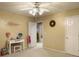 Bedroom has a ceiling fan, carpet, and desk area for studying or hobbies at 5505 Indigo Makers Trce, Charleston, SC 29418