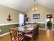 Formal dining room with seating for ten, chandelier, and views of the living spaces at 5505 Indigo Makers Trce, Charleston, SC 29418