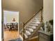 Foyer showcasing a wooden staircase and an open view to the dining room, creating an inviting entrance at 5505 Indigo Makers Trce, Charleston, SC 29418