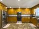 Spacious kitchen with stainless steel appliances, ample cabinet space, and tiled flooring at 5505 Indigo Makers Trce, Charleston, SC 29418