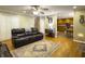 Spacious living room with hardwood floors, flowing into the kitchen, perfect for entertaining at 5505 Indigo Makers Trce, Charleston, SC 29418