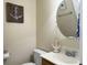A charming powder room with an anchor theme is perfect for guests at 5505 Indigo Makers Trce, Charleston, SC 29418