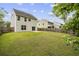 Spacious backyard features lush green grass and privacy fence, ideal for outdoor entertaining and relaxation at 558 Wynfield Forest Dr, Summerville, SC 29485