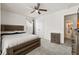 This bedroom features a ceiling fan, natural light, and a neutral color scheme, creating a cozy and inviting atmosphere at 558 Wynfield Forest Dr, Summerville, SC 29485