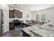 Modern kitchen featuring stainless steel appliances, granite countertops, and a breakfast bar with seating at 558 Wynfield Forest Dr, Summerville, SC 29485