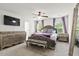 Spacious main bedroom featuring a luxurious bed, stylish furniture, and plenty of natural light from the windows at 558 Wynfield Forest Dr, Summerville, SC 29485