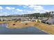 An aerial view of a picturesque community overlooking a pond and featuring a community pool at 629 Snow Owl Dr, Summerville, SC 29486